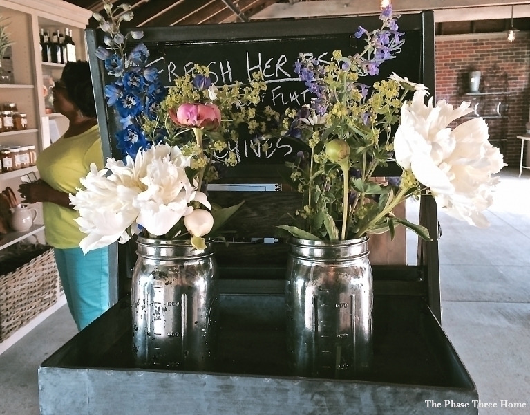 Silver painted mason jar hold gorgeous summer blooms